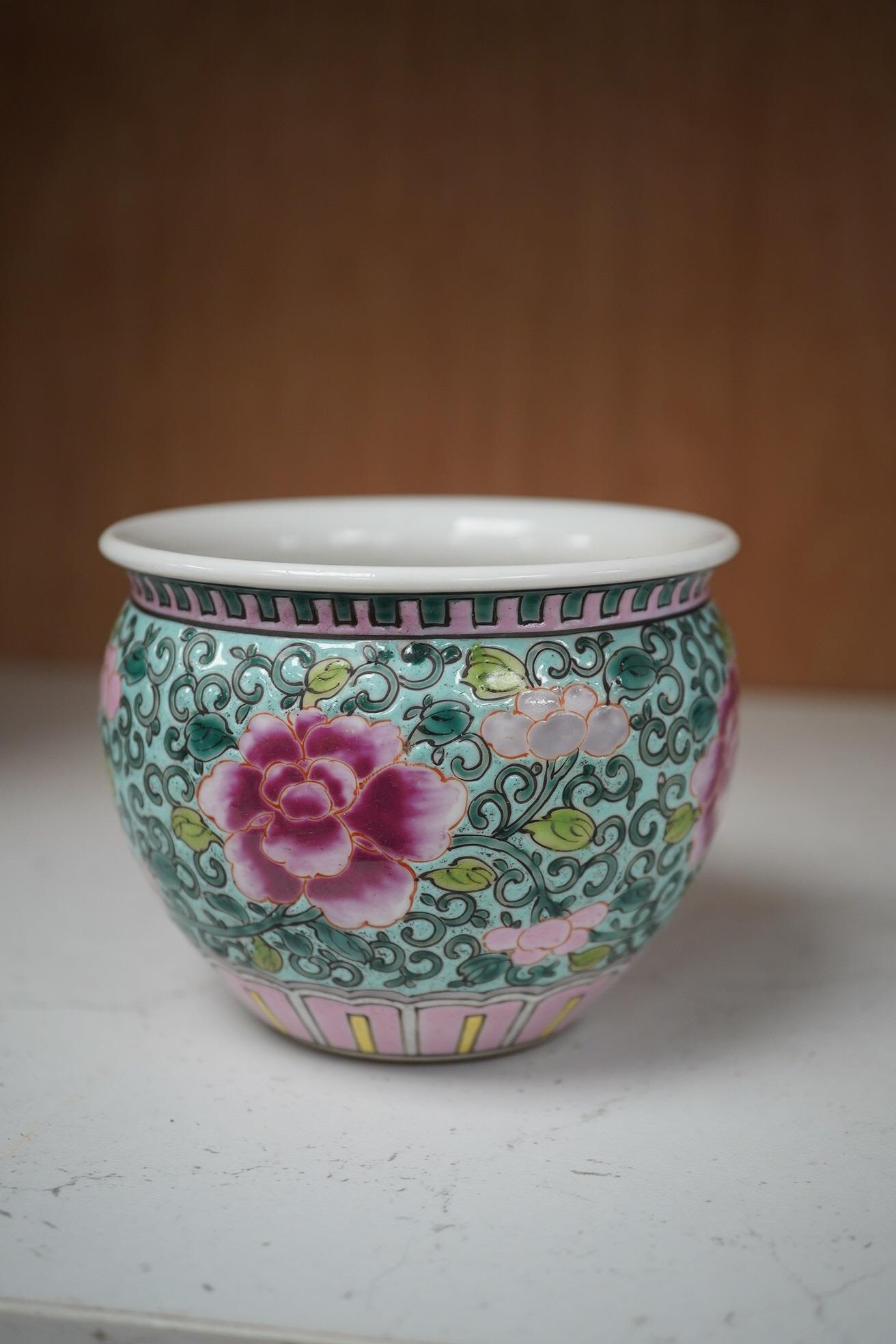 A Chinese blue and white brush pot and famille rose miniature jardiniere, tallest 12cm. Condition - good